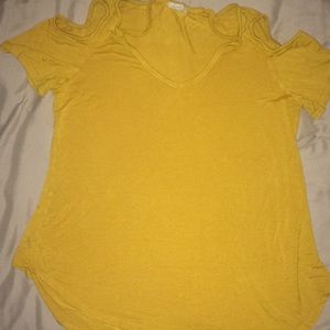 Mustard colored shirt with holes on shoulders